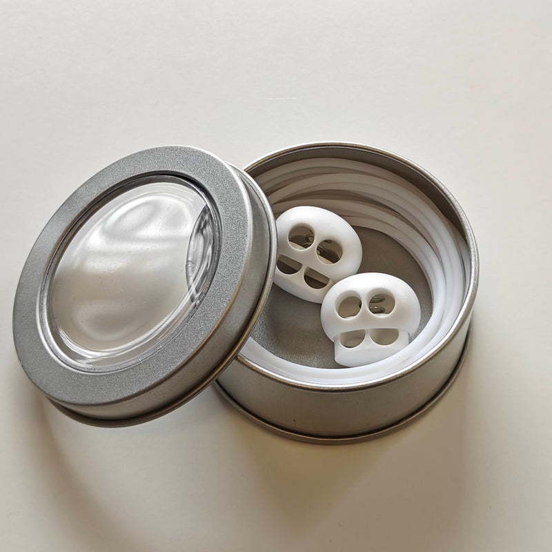 Kaapeli ja stopparit valkoinen